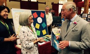 Prince of Wales congratulates Crediton Community Bookshop representatives